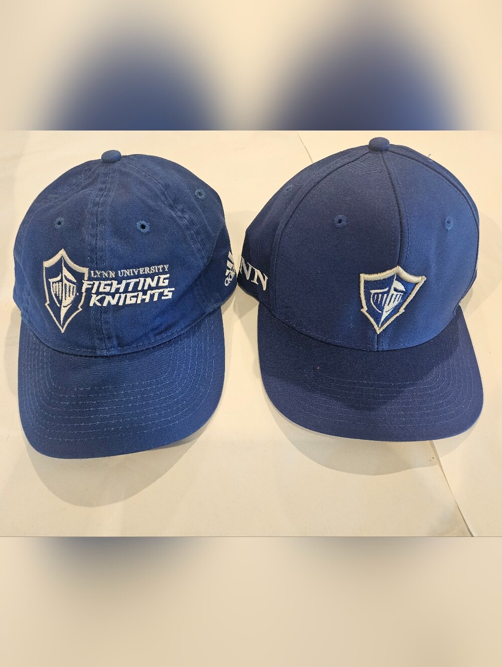 2 adidas Royal Blue Cotton Caps with Lynn University Logo Embroidered On.
